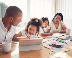Hình ảnh về People working on laptops or parents with children studying online