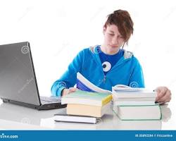 Hình ảnh về Person studying with laptop and books